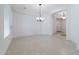 Spacious living area with neutral paint, tile flooring, and plenty of natural light at 27380 N 128Th Ln, Peoria, AZ 85383