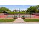 Tennis court with seating and mature landscaping at 27380 N 128Th Ln, Peoria, AZ 85383