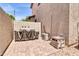 Enclosed backyard featuring brick pavers, an outdoor grill, and air conditioning units at 3029 E Patrick St, Gilbert, AZ 85295