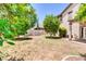 This backyard has mature trees, space to play and covered outdoor living space at 3029 E Patrick St, Gilbert, AZ 85295