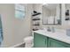 Bathroom featuring a modern sink, floating shelves, and neutral decor with plenty of light at 3029 E Patrick St, Gilbert, AZ 85295