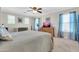 Bedroom with neutral walls, a ceiling fan, and natural light from multiple windows at 3029 E Patrick St, Gilbert, AZ 85295