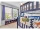 Bedroom featuring bunk beds, natural light, and built-in shelves with toys at 3029 E Patrick St, Gilbert, AZ 85295