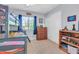 Cozy bedroom featuring a bunk bed, gray walls, neutral carpet, and a window with natural light at 3029 E Patrick St, Gilbert, AZ 85295