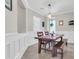 Bright dining room features a wood table and bench, modern lighting, and decorative molding at 3029 E Patrick St, Gilbert, AZ 85295