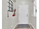 Welcoming entryway showcasing a white front door, decorative mirror, and neutral decor at 3029 E Patrick St, Gilbert, AZ 85295