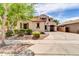 Charming stucco home featuring a terracotta tile roof and lush, mature landscaping at 3029 E Patrick St, Gilbert, AZ 85295