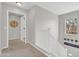 Bright hallway featuring neutral walls, carpeted floors, and a window with natural lighting at 3029 E Patrick St, Gilbert, AZ 85295