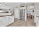 Bright kitchen featuring a stainless steel fridge, a view of dining area, and plenty of cabinet space at 3029 E Patrick St, Gilbert, AZ 85295