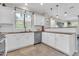 Bright and airy kitchen with stainless steel appliances and ample countertop space with recessed lighting at 3029 E Patrick St, Gilbert, AZ 85295