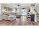 Well-decorated living room with comfortable sofa, wood floors, ceiling fan, and a staircase at 3029 E Patrick St, Gilbert, AZ 85295