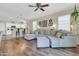 Open-concept living room featuring a large sectional sofa and wood flooring at 3029 E Patrick St, Gilbert, AZ 85295