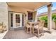Covered patio featuring an outdoor dining area with French doors leading inside at 3029 E Patrick St, Gilbert, AZ 85295