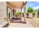 Inviting covered patio with brick flooring, outdoor seating, and a view of the backyard at 3029 E Patrick St, Gilbert, AZ 85295