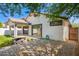 A cozy backyard with block-paved patio, an outdoor firepit, and desert landscaping at 3528 W Paseo Way, Laveen, AZ 85339