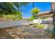 Beautiful backyard with a charming stone paver patio, a fire pit, and block wall for privacy at 3528 W Paseo Way, Laveen, AZ 85339
