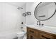 Bathroom with a shower over tub and custom cabinetry at 3528 W Paseo Way, Laveen, AZ 85339