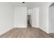 Bright bedroom with wood-look floors and a ceiling fan at 3528 W Paseo Way, Laveen, AZ 85339