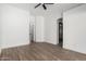 Bright bedroom with wood-look floors and a ceiling fan at 3528 W Paseo Way, Laveen, AZ 85339