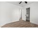 Bedroom features wood-look floors, an open closet, and a ceiling fan at 3528 W Paseo Way, Laveen, AZ 85339