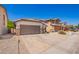 Front exterior of single-story home with desert landscaping at 3528 W Paseo Way, Laveen, AZ 85339