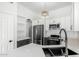 Modern kitchen featuring white cabinets, stainless steel appliances, and quartz countertops at 3528 W Paseo Way, Laveen, AZ 85339