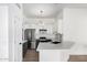 Modern kitchen with white cabinets and stainless steel appliances at 3528 W Paseo Way, Laveen, AZ 85339
