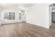 Inviting living room featuring wood-look tile floors and bright entryway at 3528 W Paseo Way, Laveen, AZ 85339
