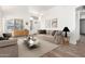 Staged living room with contemporary furniture and stylish decor at 3528 W Paseo Way, Laveen, AZ 85339