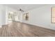 Bright living room with wood-look tile floors and archway at 3528 W Paseo Way, Laveen, AZ 85339