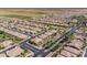 Community aerial view displaying a well-planned neighborhood with homes, streets, and nearby farmland at 36042 N Desert Tea Dr, Queen Creek, AZ 85140