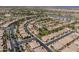 Overhead view of a community, highlighting lush green spaces, winding streets, and diverse housing options at 36042 N Desert Tea Dr, Queen Creek, AZ 85140