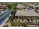 Aerial view of a well-maintained backyard with a patio and desert landscaping in a residential neighborhood at 36042 N Desert Tea Dr, Queen Creek, AZ 85140