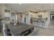 Open concept dining area that leads to the kitchen, with natural lighting and decorative artwork at 36042 N Desert Tea Dr, Queen Creek, AZ 85140