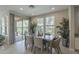 Lovely dining space with access to outdoor patio, natural light, and well-maintained tile flooring at 36042 N Desert Tea Dr, Queen Creek, AZ 85140