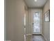 Welcoming entryway with decorative glass front door and tiled flooring that leads into the home at 36042 N Desert Tea Dr, Queen Creek, AZ 85140