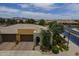 Charming home featuring a two-car garage, desert landscaping, and a welcoming front entryway at 36042 N Desert Tea Dr, Queen Creek, AZ 85140