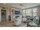 Inviting living room with a fireplace, built-in shelves, and comfortable seating at 36042 N Desert Tea Dr, Queen Creek, AZ 85140