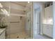Modern tiled shower with built-in seat and grab bar at 36042 N Desert Tea Dr, Queen Creek, AZ 85140