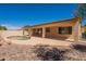 An inviting backyard featuring a pool, covered patio, and landscaping, perfect for outdoor living at 3665 E Thames Way, San Tan Valley, AZ 85140
