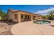 A serene backyard with a pool and covered patio, offering relaxation and entertainment possibilities at 3665 E Thames Way, San Tan Valley, AZ 85140