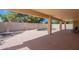 A spacious backyard with a pool, covered patio, and lush greenery for outdoor enjoyment at 3665 E Thames Way, San Tan Valley, AZ 85140