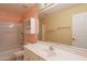 Well-lit bathroom featuring a large mirror, vanity, and a shower-tub combo for relaxing at 3665 E Thames Way, San Tan Valley, AZ 85140