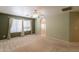 Neutral bedroom with ceiling fan and natural light leads to bathroom area at 3665 E Thames Way, San Tan Valley, AZ 85140