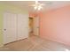 Bright bedroom featuring a ceiling fan, carpet, and a closet offering great storage at 3665 E Thames Way, San Tan Valley, AZ 85140