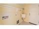 Convenient laundry room with a utility sink, storage shelves, and direct access to the outdoors at 3665 E Thames Way, San Tan Valley, AZ 85140