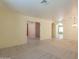 Large living room with neutral carpet, tile entry, a chandelier, and an open concept at 3665 E Thames Way, San Tan Valley, AZ 85140