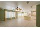 Spacious living area connects to the kitchen area with natural light at 3665 E Thames Way, San Tan Valley, AZ 85140
