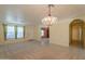 Inviting living room with a chandelier, tile entry, and an open floor plan at 3665 E Thames Way, San Tan Valley, AZ 85140