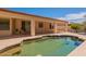 Inviting backyard pool with a covered patio and beautiful surroundings for outdoor enjoyment at 3665 E Thames Way, San Tan Valley, AZ 85140